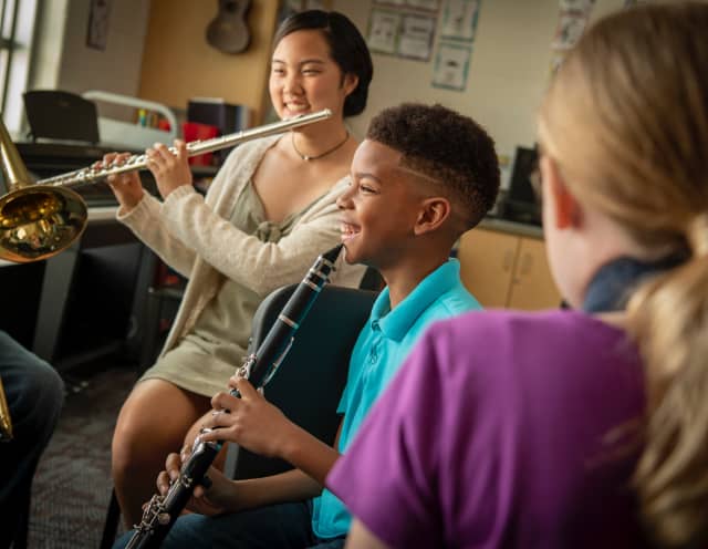 Students playing their woodwind instruments