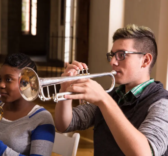 A boy playing the trumpet