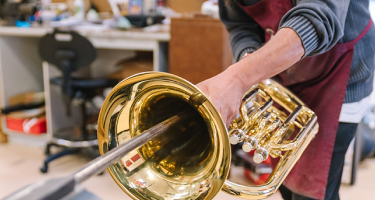 A person is repairing the trumpet #1